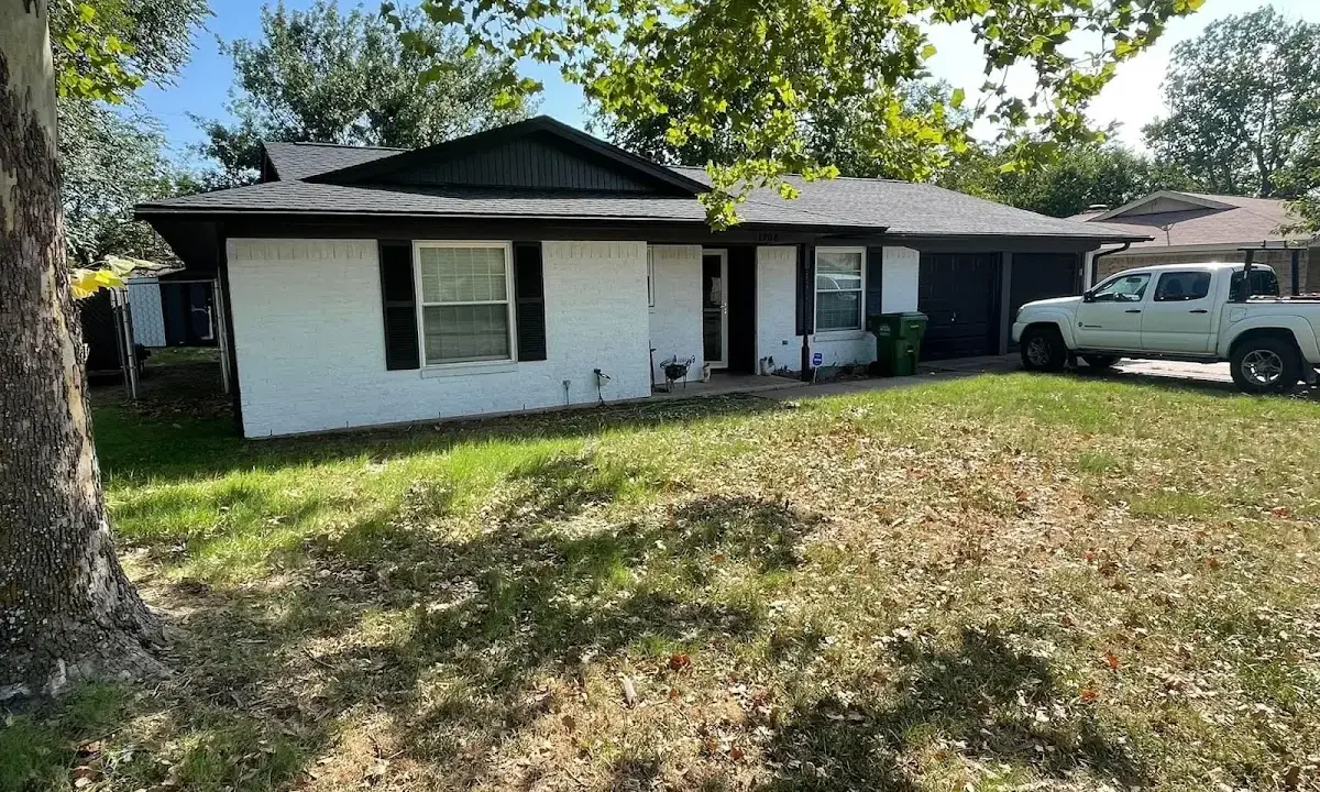 Professional roofing crew working on a residential roof in Downers Grove